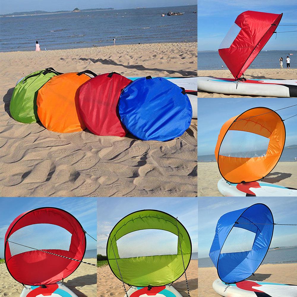 Multiple colors of kayak sail kits on the beach